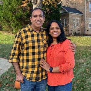 Varughese and his wife from the US, happy guests of Tour With Anand, posing during their Kerala trip.